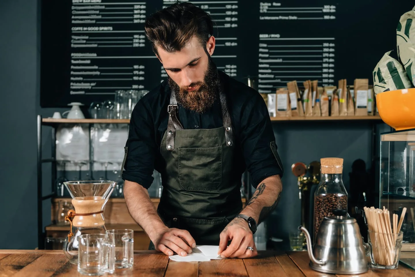 Barista Pours Water From Coffee Pot